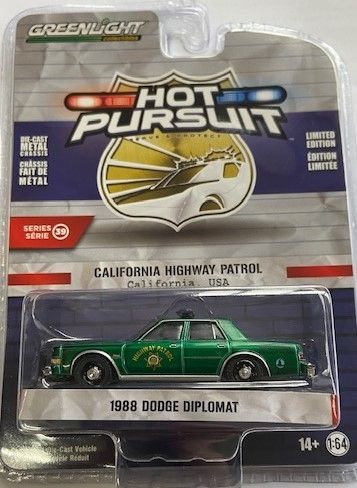 GREEN42970-CVERT - DODGE Diplomat 1988 Green Patrol of Califonia HOT PURSUIT Serie 39 im Blister - 1